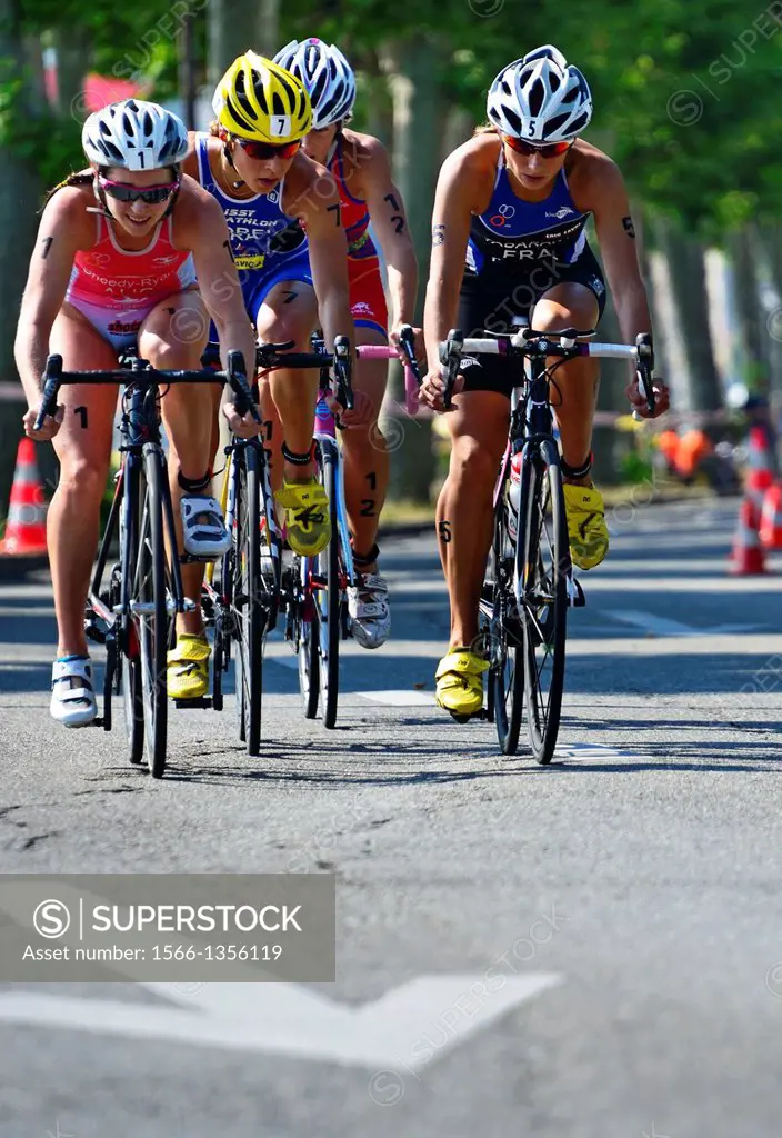 four female athletes, biking race, 25th International Geneva Triathlon, on July 21, 2013, Quai du Mont-Blanc, Geneva, Switzerland