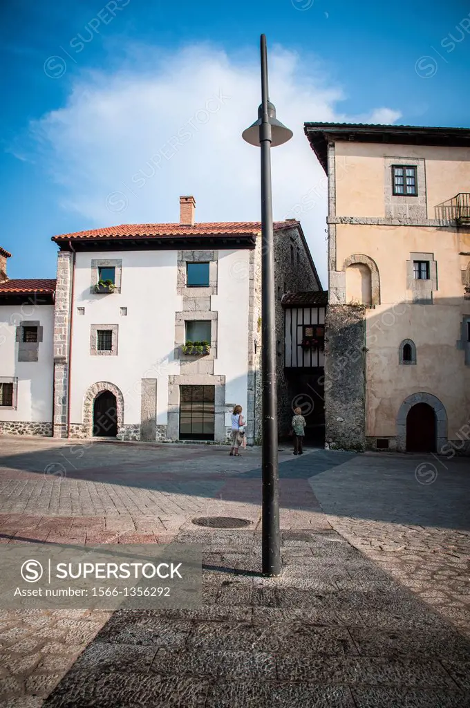 Image of Old Llanes. The areas where the wall missing, are marked with darker pavement.Asturias. Spain.