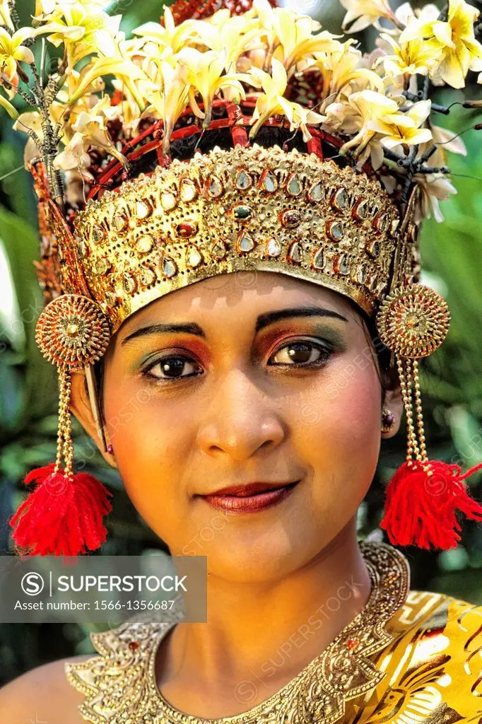 Beautiful golden bride in colorful traditional dress in wedding in Bali Indonesia