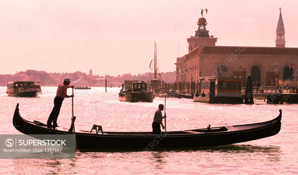 Gondola and gondolier, Venetian Lagoon, Venice, Veneto, Italy, Europe.
