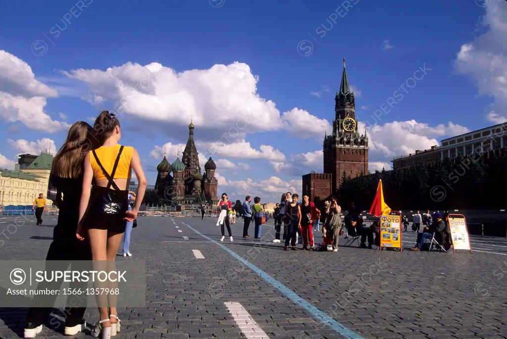 RUSSIA, MOSCOW, RED SQUARE WITH ST BASIL'S CATHEDRAL, SPASSKAYA TOWER, GIRL IN MINI SKIRT.