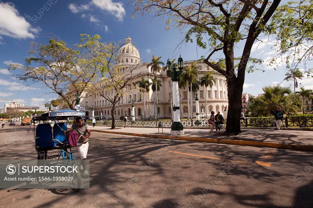 Capitolio building with a bicitaxi driver in the foreground, Havana, Cuba, West Indies, Central America.1015