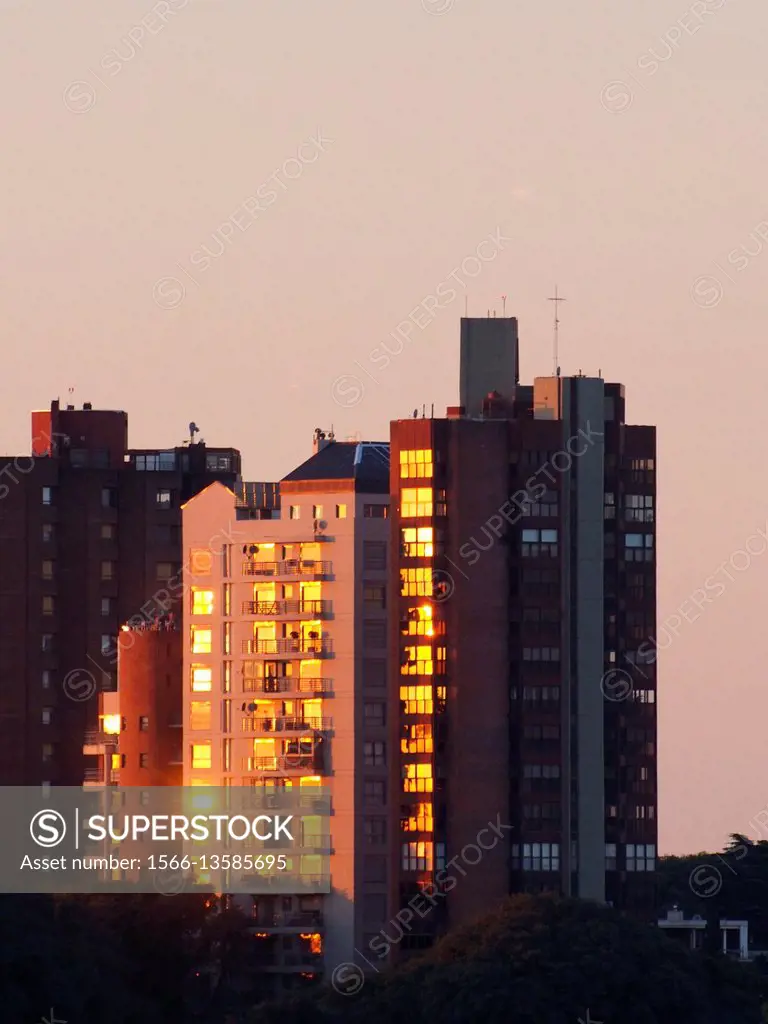 Golden sunset reflections on buildings windows. San Isidro District. Buenos Aires Metropolitan Area, Argentina.