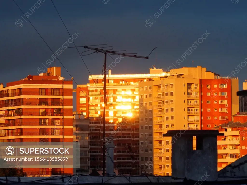Golden sunset reflections on buildings windows. Vicente Lopez District. Buenos Aires Metropolitan Area, Argentina.