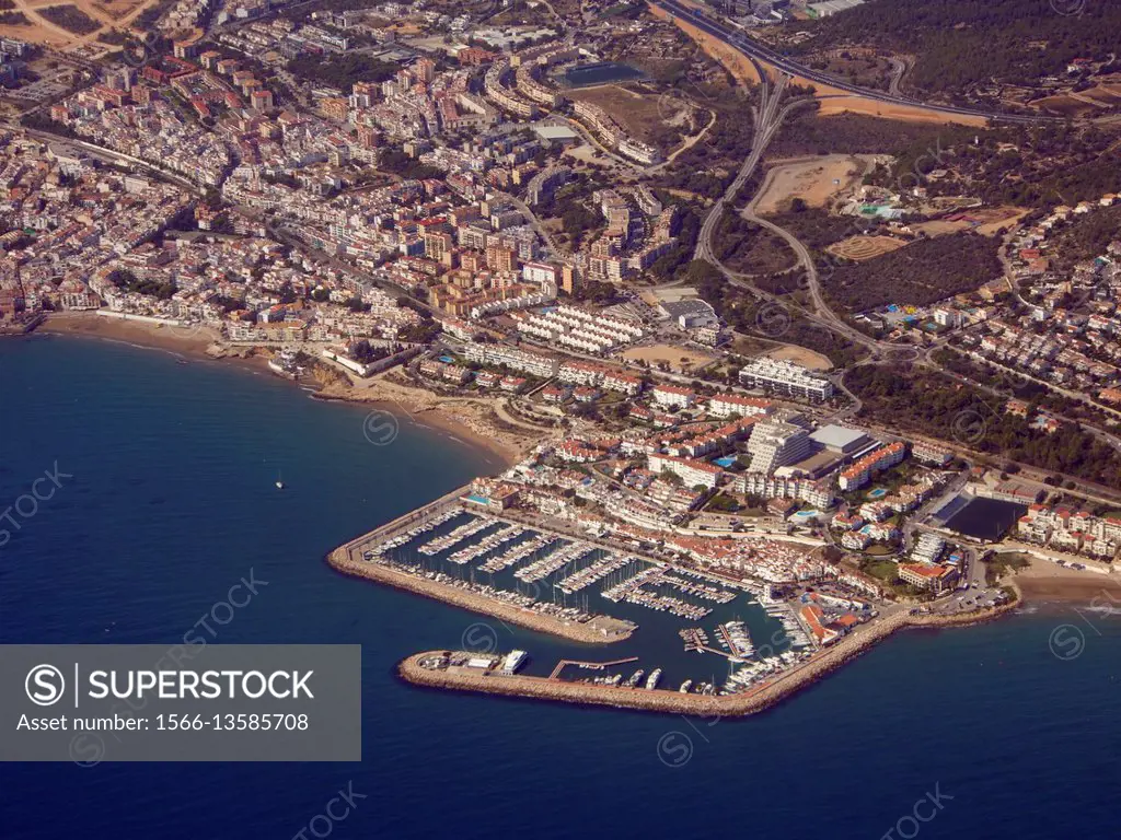 Aerial view of Aiguadolç Leisure Harbour and Sitges Village, Garraf Region, Barcelona Metropolitan Area, Catalonia, Spain.