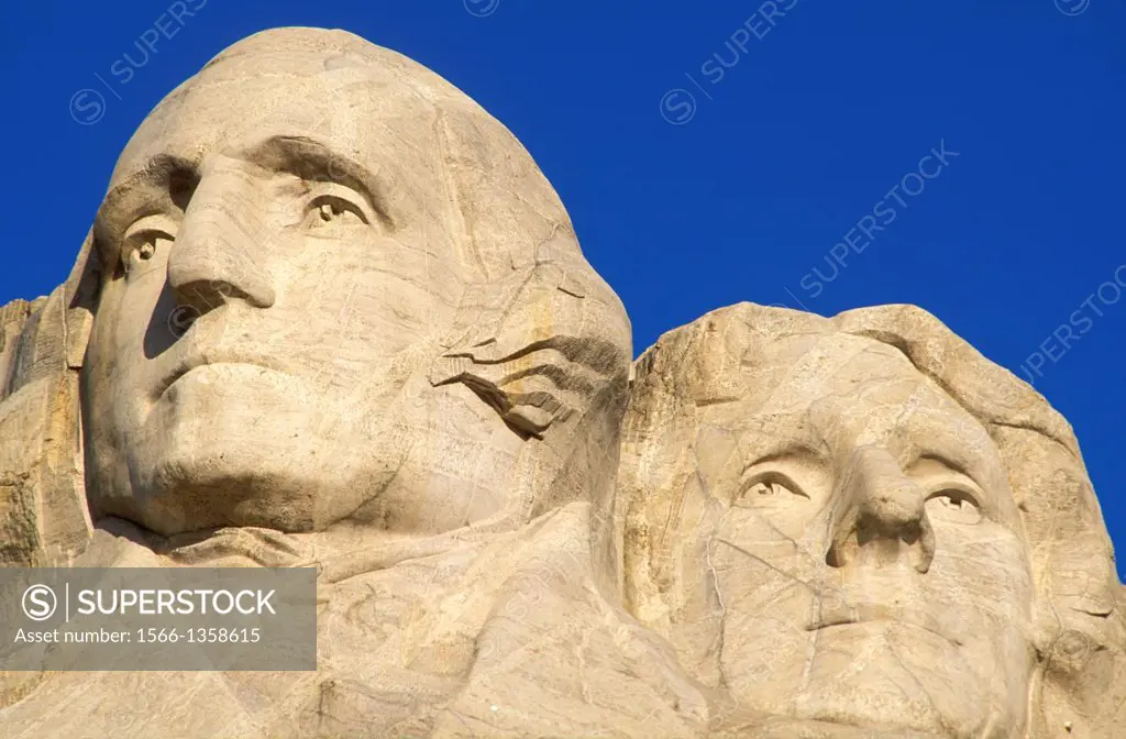 Morning light on Washington and Jefferson faces on Mount Rushmore, Mount Rushmore National Memorial, South Dakota.