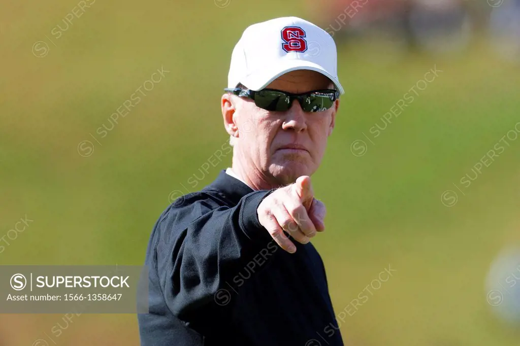 Oct 22, 2011; Charlottesville VA, USA; North Carolina State Wolfpack head coach Tom O'Brien directs his team during warm ups before the game against t...