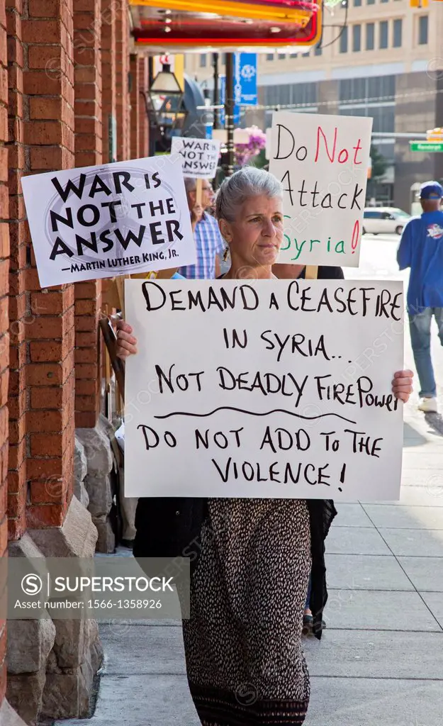 Detroit, Michigan - Opponents of war with Syria picket Congressman Gary Peters' Detroit office, asking him to vote against President Obama's plan to b...