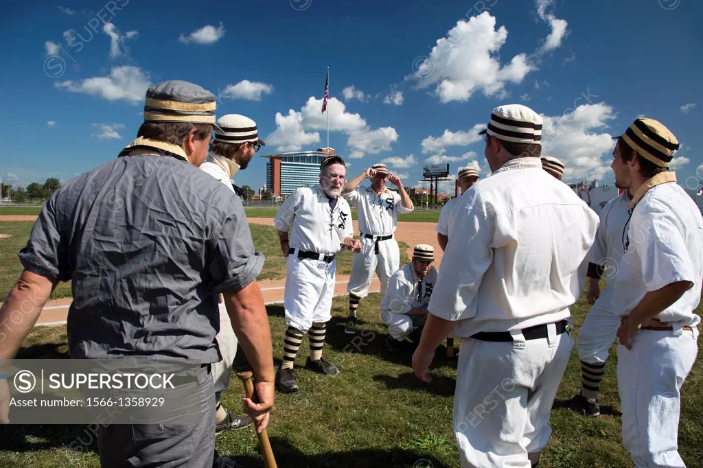 Detroit, Michigan - Players from the Saginaw Old Golds huddle before playing a vintage base ball game with the Wyandotte Stars. The teams play using u...