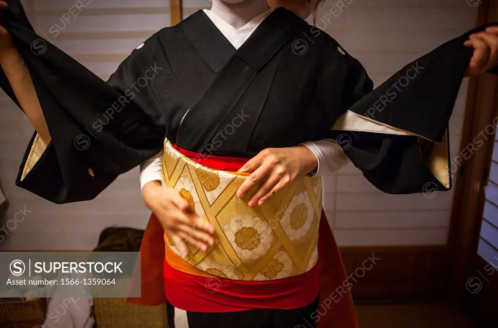 Toshiyu dressing in her Okiya (geisha house).Geisha from geisha´s distric of Miyagawacho.Kyoto. Kansai, Japan.