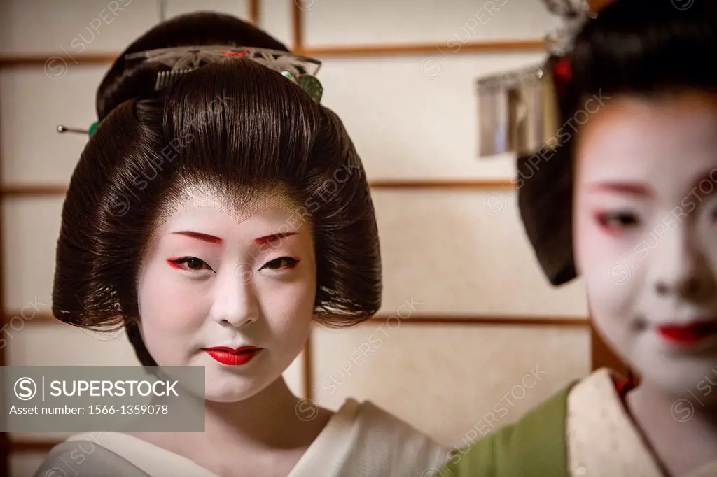 Fukuyu,geisha and Fukukimi,´maiko´ (geisha apprentice). from Ishihatsu okiya (geisha house).Geisha´s distric of Miyagawacho.Kyoto. Kansai, Japan.
