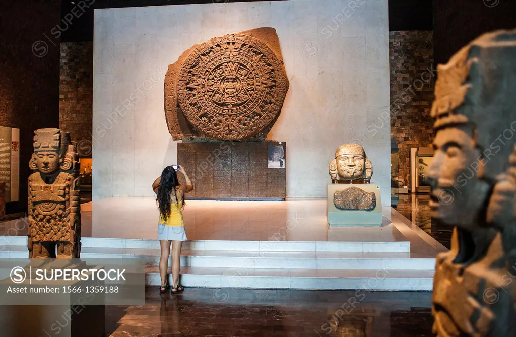 The Aztec Stone of the Sun and other artifacts on display at National Museum of Anthropology, Mexico City, Mexico.