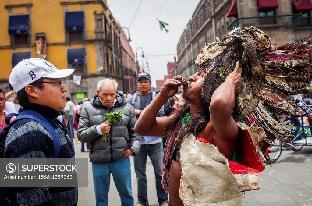 Aztec folk healer, shaman practising spiritual cleansing,Plaza de la Constitución, El Zocola, Zocola Square, Mexico City, Mexico.