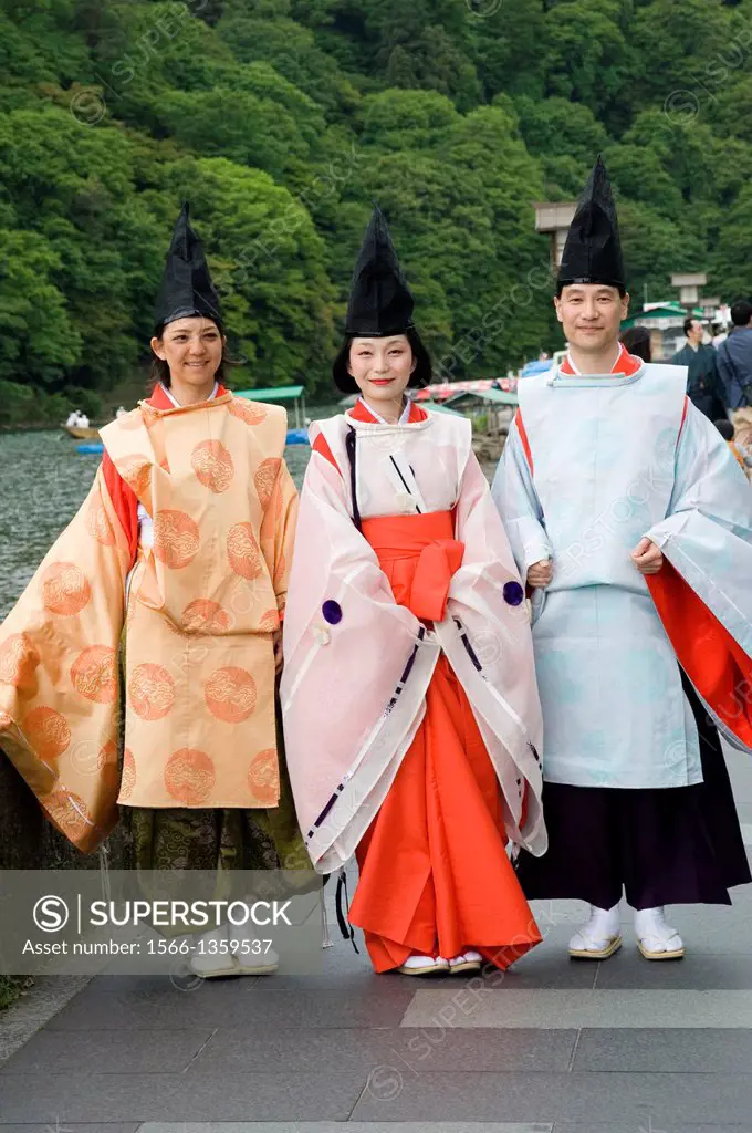 Hozu River; Arashiyama; Kyoto; Japan; Fune Matsuri; Boat Festival, Lady and two men in costumes of Heian Period Court, Japanese traditions, Ceremonial...