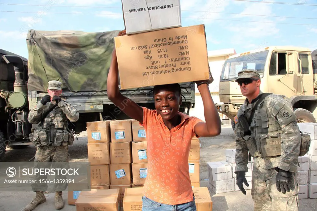 Aid distribution in Port au Prince following the earthquake of January 2010. Aid provide by Shelterbox and distributed with the help of 82nd Airborne,...