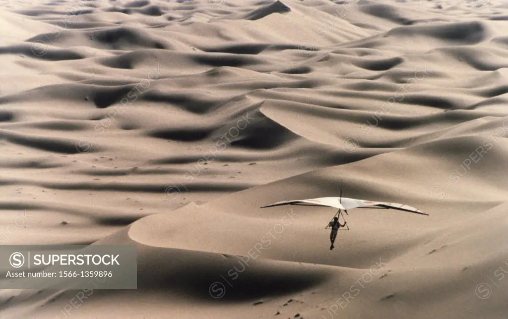 Hangliding over the dunes of the Sahara Desert.