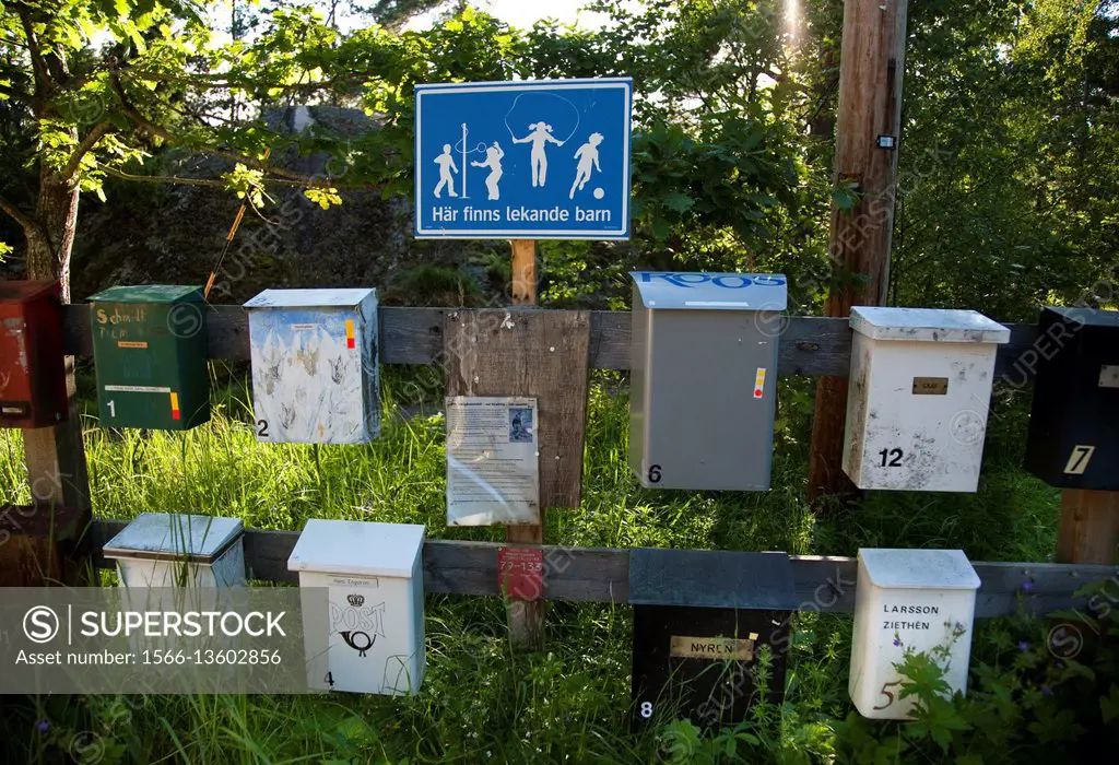 Signs and postboxes out on the Swedish countryside.