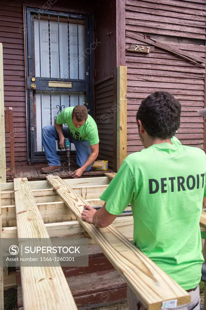 Detroit, Michigan - Volunteers build a wheelchair ramp for a disabled resident during a week-long community improvement initiative called Life Modeled...