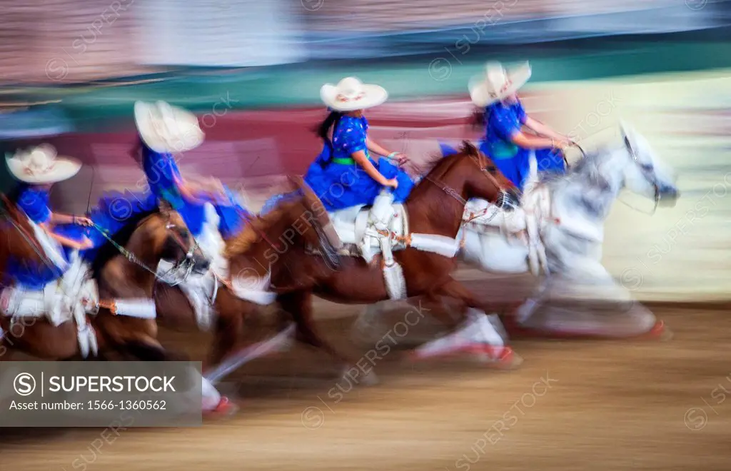 Escaramuzas ride their horses. A charreada Mexican rodeo at the Lienzo Charro Zermeno, Guadalajara, Jalisco, Mexico.