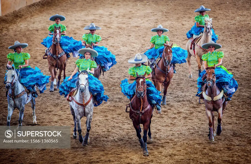 Escaramuzas ride their horses. A charreada Mexican rodeo at the Lienzo Charro Zermeno, Guadalajara, Jalisco, Mexico.