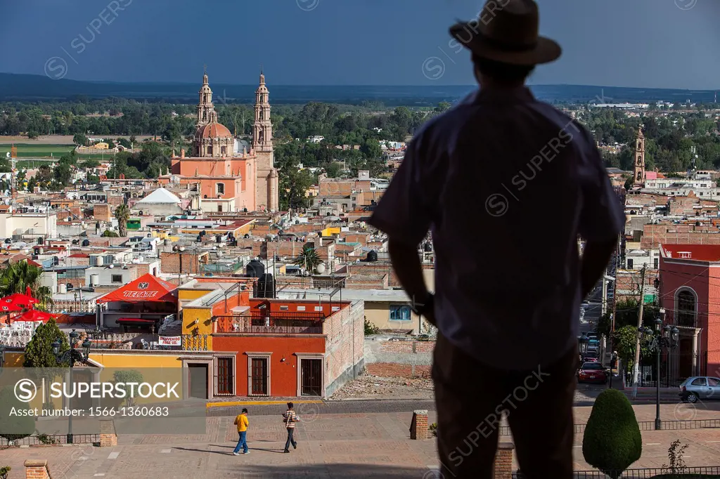 View from `El Calvario´. Man, in background Parroquia de la Asunción de María, Lagos de Moreno, Jalisco, Mexico.