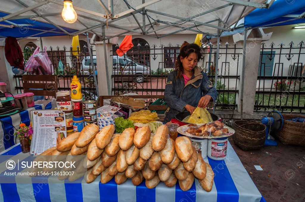 Selling popular fresh bread in Luang Phrabang night market, Laos.