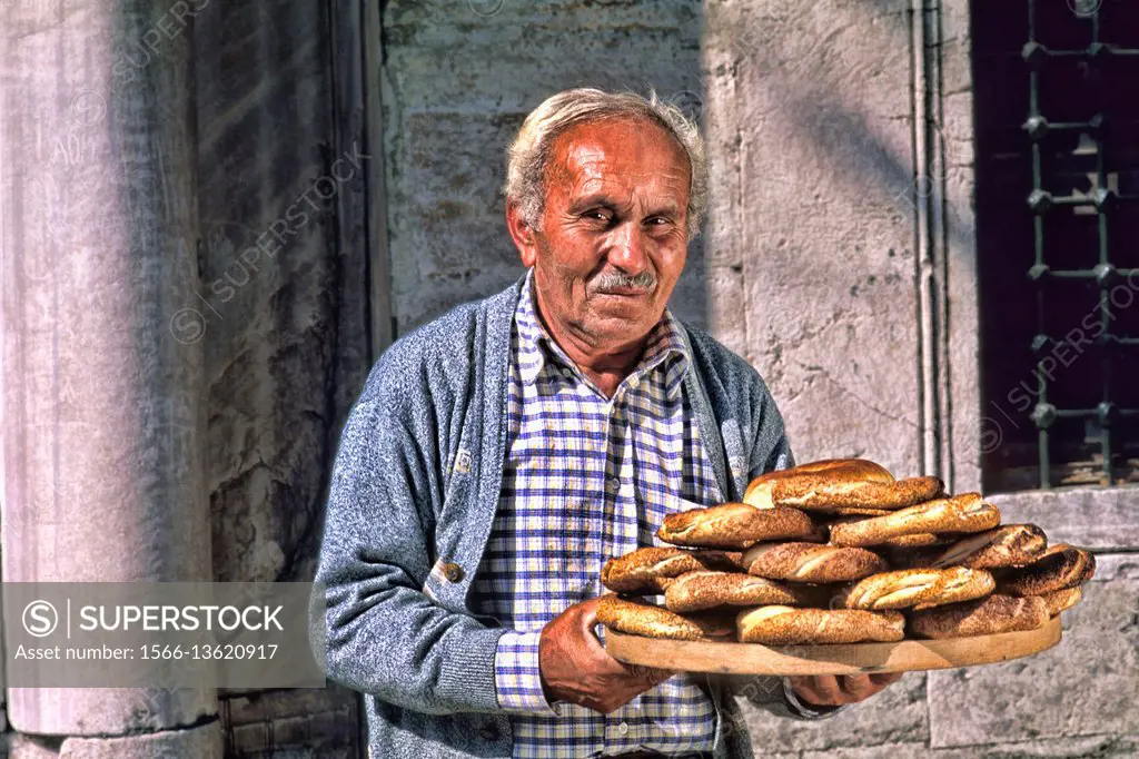 Local man selling bread with colorful scene in Istanbul Turkey