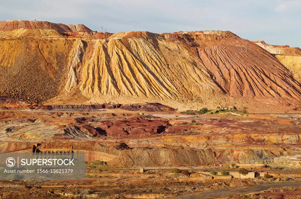 Dramatic landscape of mineral-rich ground and rock, scarred by the open-cast mineworkings of the Rio Tinto mines at the town of Minas de Riotinto. Hue...