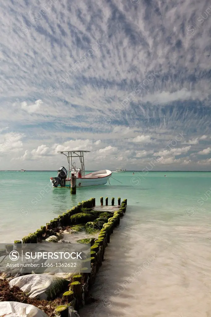 A damaged pier and a boat on Isla Mujeres Island, Cancun, Quintana Roo, Yucatan Peninsula, Mexico.