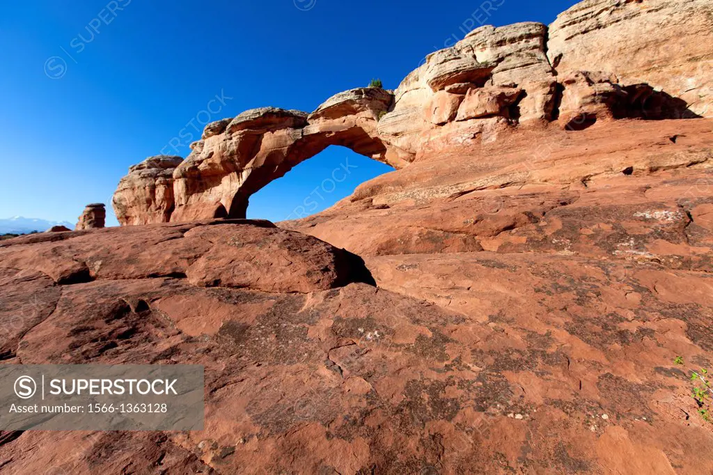 Broken Arch. Water and ice, extreme temperatures, and underground salt movement are responsible for the scultured rock scenery of Arches National Park...