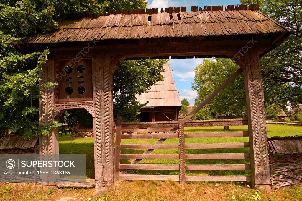 19th century traditional farm house & gate of the Iza Valley, The Village museum near Sighlet, Maramures, Northern Transylvania.