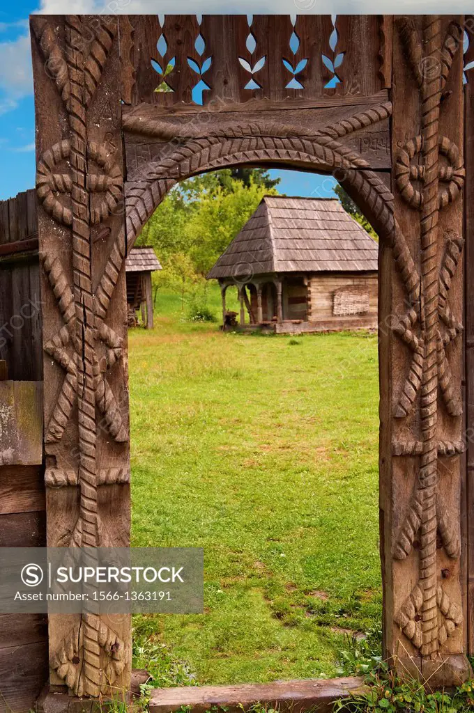 19th century traditional farm house & gate of the Iza Valley, The Village museum near Sighlet, Maramures, Northern Transylvania.