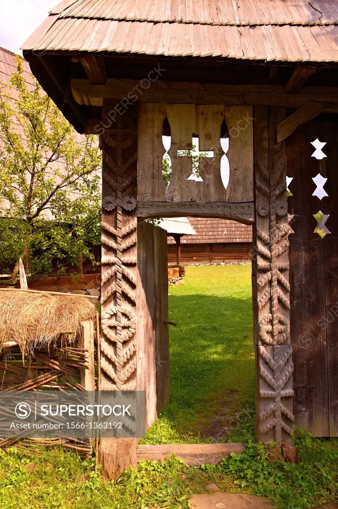 19th century traditional farm house & gate of the Iza Valley, The Village museum near Sighlet, Maramures, Northern Transylvania.