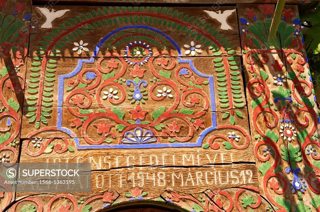 Traditional wooden Szekely gates in a Szekely village near Cluj, Eastern Transylvania. Carved with folk art & painted the Szekely gate also has dove c...