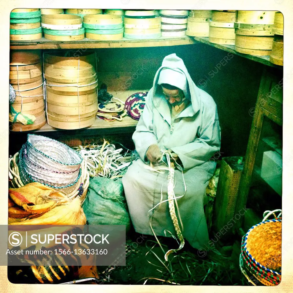 Man weaving baskets in Fez market, Morocco, Africa