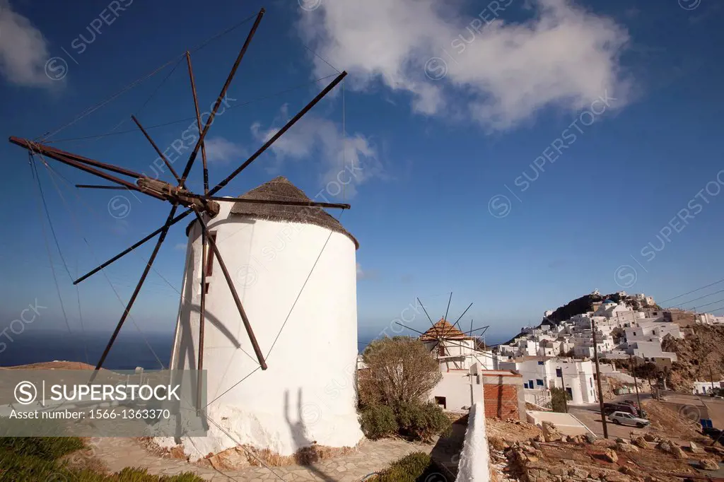 View of the main town Chora with a traditional windmill in the foreground, Serifos, Cyclades Islands, Greek Islands, Greece, Europe.
