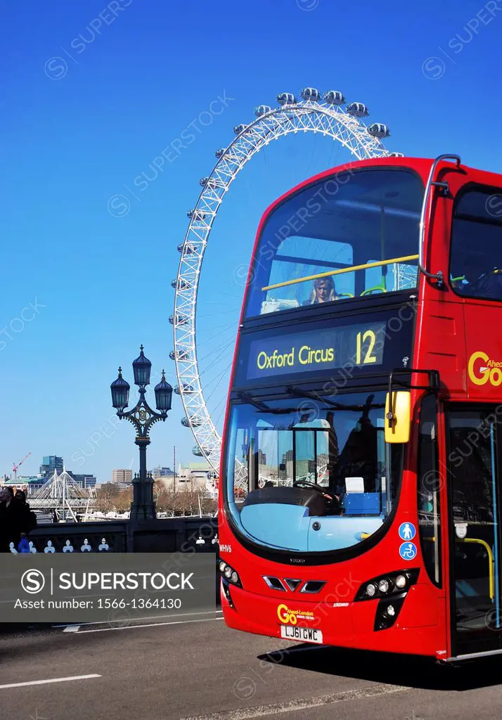London icons - a red double-decker bus crosses Westminster Bridge across the River Thames with the London Eye in the background, on a sunny day.