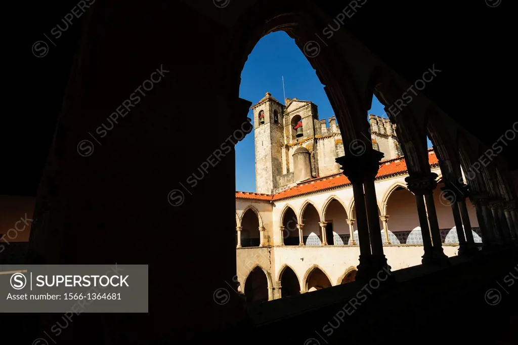 church framed by the upper arches of the cloister Do Cemiterio, Convent of Christ, year 1162, Tomar, District of Santarem, Medio Tejo, region center, ...