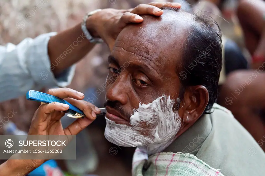 Shaving on the Street in Kolkata, India.
