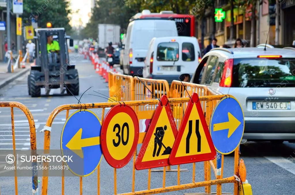 Traffic jam. Maintenance work on a street. Traffic Signs. Queue of vehicles. Barcelona, Catalonia, Spain.