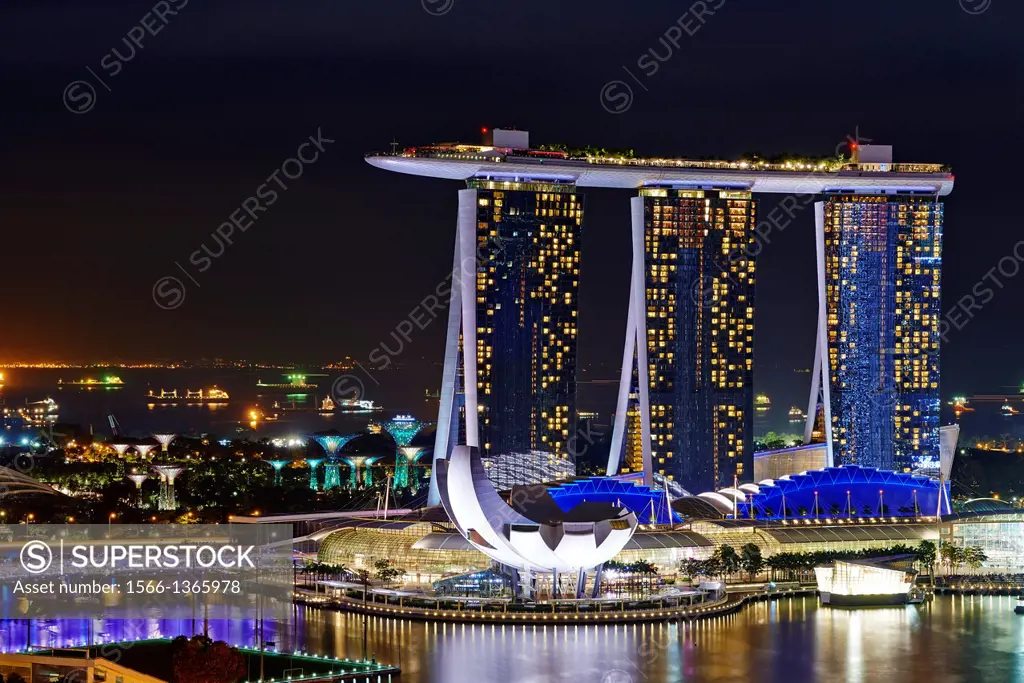 Aerial night view of Marina Bay Sand, a luxury complex that include hotel, casino, exhibition centre and a shopping mall. Singapore.