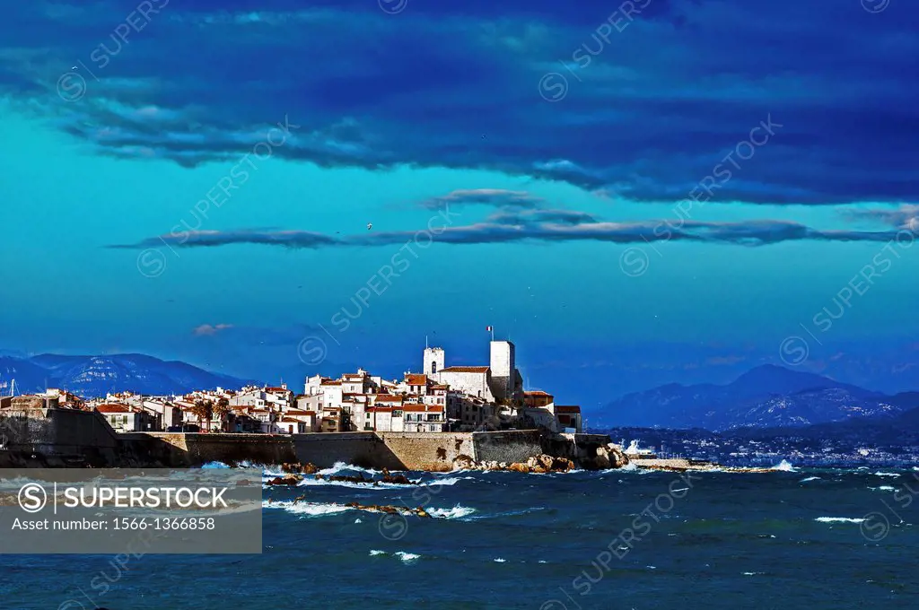 Europe, France, Alpes-Maritimes, Antibes, old town walls under a stormy sky.