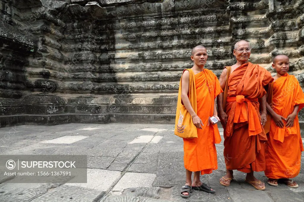 Buddhist Monks in the Temple Compound of Angkor Wat in Cambodia