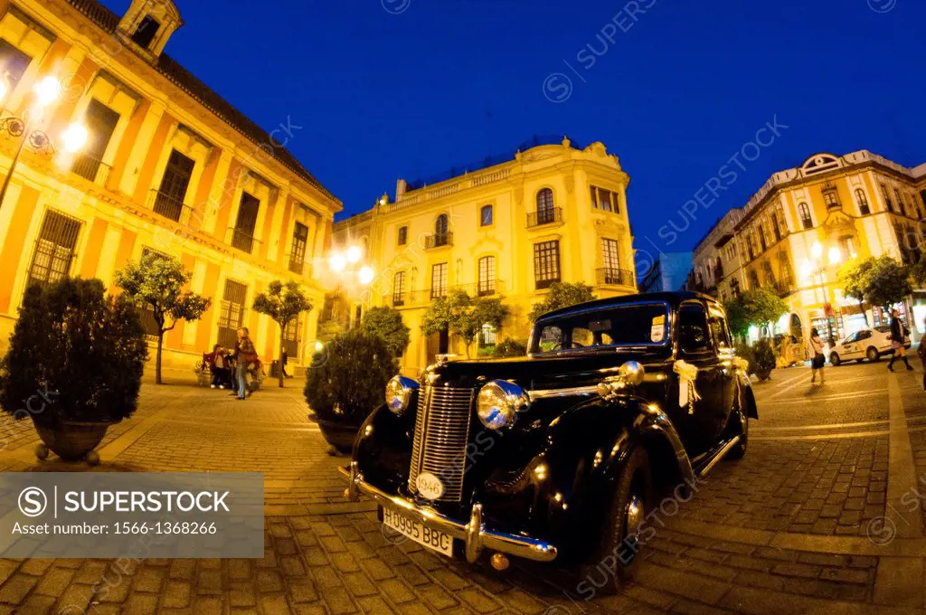 Antique car night shot in Plaza del Triunfo. Sevilla
