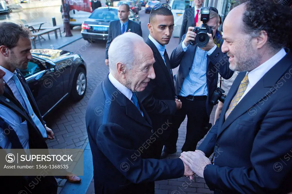 Shimon Peres (90) vists anne frank house in Amsterdam, welcomed by Ronald Leopold, director of the musem.