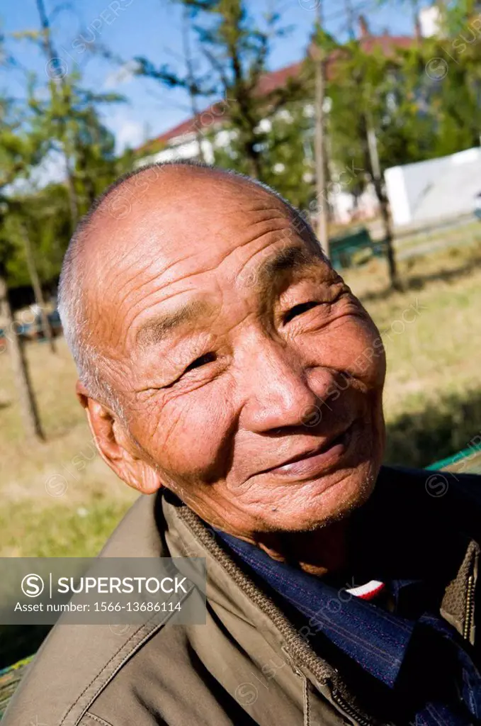 A smiling Mongolian man