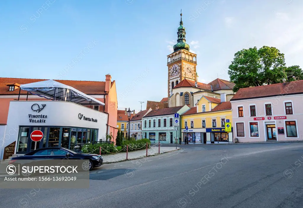 Vinoteka Volarik wine shop and bell tower of Saint Wenceslas Church in Mikulov town, Moravia region, Czech Republic.
