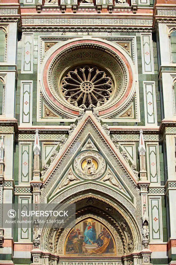 The right door mosaic and the fine Gothic architectural detail and Rose window of the of the Gothic-Renaissance Duomo of Florence, Basilica of Saint M...