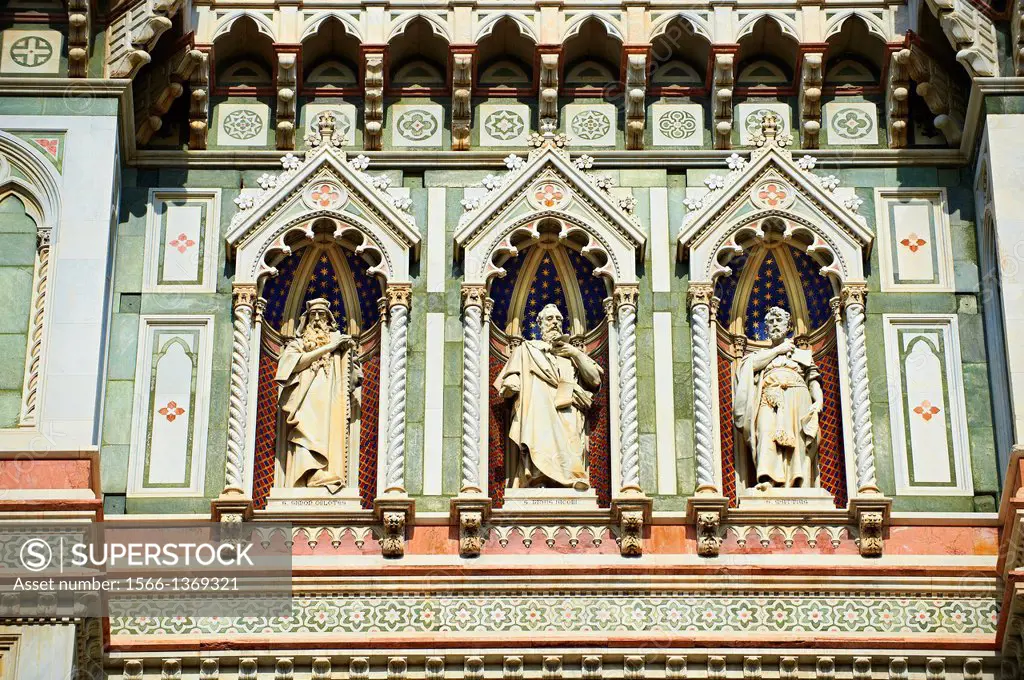 Statues of the Apostles and the the fine Gothic architectural detail of the of the Gothic-Renaissance Duomo of Florence, Basilica of Saint Mary of the...