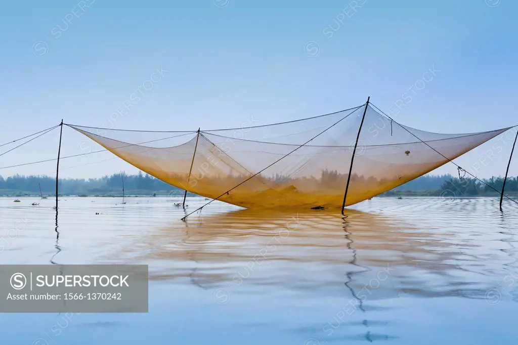 Large fishing nets in the Thu Bon River near Hoi An, Vietnam, Asia
